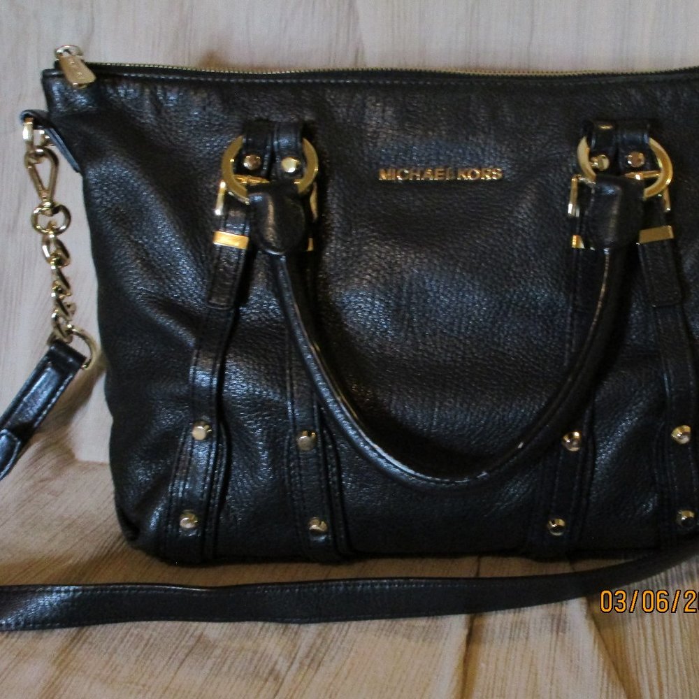Michael Kors black leather bag.  12 inches by 10 inches.